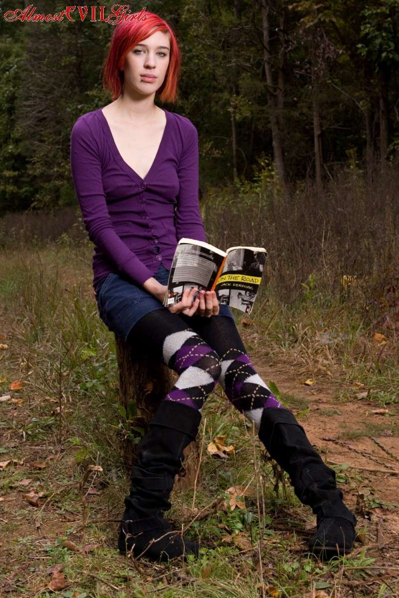 Redhead chick exposes upskirt Redhead chick exposes upskirt